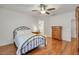 Bedroom featuring a comfortable bed, hardwood floors, and a ceiling fan at 2857 N Mystic Ct, Casa Grande, AZ 85122
