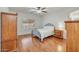 Bedroom with natural light, hardwood floors, and a ceiling fan at 2857 N Mystic Ct, Casa Grande, AZ 85122