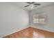 Bedroom with window, hardwood floors, and a ceiling fan at 2857 N Mystic Ct, Casa Grande, AZ 85122