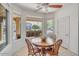 Bright breakfast nook with a view of the front yard, tiled floors and fan at 2857 N Mystic Ct, Casa Grande, AZ 85122
