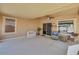 Spacious covered patio with neutral tones, ceiling fan, and view of the backyard at 2857 N Mystic Ct, Casa Grande, AZ 85122