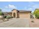 Inviting single-story home featuring a two car garage and well maintained landscaping at 2857 N Mystic Ct, Casa Grande, AZ 85122