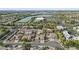 Picturesque aerial view showcases the neighborhood's homes, landscaping, community lake, and surrounding greenery at 2894 E Nolan Pl, Chandler, AZ 85249