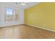 Bright bedroom features wood floors, a ceiling fan and sun-filled windows at 2894 E Nolan Pl, Chandler, AZ 85249