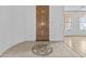 Inviting foyer featuring tiled floors with decorative inlay and a classic wood front door at 2894 E Nolan Pl, Chandler, AZ 85249