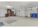 Spacious 3-car garage with epoxy floors, storage cabinets, and overhead lighting at 2894 E Nolan Pl, Chandler, AZ 85249