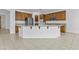 Spacious kitchen with an island, granite counters, stainless appliances, and wooden cabinets at 2894 E Nolan Pl, Chandler, AZ 85249