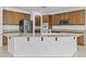 Gourmet kitchen with custom cabinets, granite countertops, and stainless steel appliances, perfect for cooking at 2894 E Nolan Pl, Chandler, AZ 85249