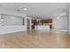 Open floor plan showcasing a living room and kitchen with ceiling fans, recessed lights, and neutral colors at 2894 E Nolan Pl, Chandler, AZ 85249