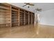 Spacious living room features beautiful wood floors, built-in bookshelves, and bright, natural light at 2894 E Nolan Pl, Chandler, AZ 85249