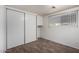 Modest bedroom featuring wood floor, a closet, a window with blinds, and white walls at 300 S Val Vista Dr # 167, Mesa, AZ 85204