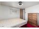 Modest bedroom featuring dresser, bed, window with blinds, and doorway at 300 S Val Vista Dr # 167, Mesa, AZ 85204