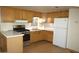 Kitchen features wooden cabinets, stainless steel appliances and white countertops at 300 S Val Vista Dr # 167, Mesa, AZ 85204