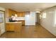 Open floor plan showing a living space and kitchen with wood-look flooring at 300 S Val Vista Dr # 167, Mesa, AZ 85204