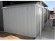 Exterior of a metal shed with a door and concrete path leading to it at 300 S Val Vista Dr # 167, Mesa, AZ 85204