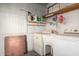 Utility room with washer and dryer and cleaning supplies on the shelf at 300 S Val Vista Dr # 167, Mesa, AZ 85204