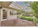 Covered back patio with brick flooring offering a serene outdoor living space at 302 E Orange Dr, Phoenix, AZ 85012