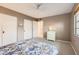 Serene bedroom with a neutral color palette, carpet flooring, ample closet space, and natural light at 302 E Orange Dr, Phoenix, AZ 85012
