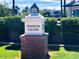 Elegant Windsor Square community sign featuring classic typography and brick base, set amidst lush greenery at 302 E Orange Dr, Phoenix, AZ 85012