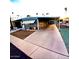 Cozy home featuring desert landscaping and covered parking, perfect for easy living at 303 S Recker Rd # 74, Mesa, AZ 85206