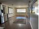 Bright living room with hardwood floors, natural light, and stainless steel fridge at 303 S Recker Rd # 74, Mesa, AZ 85206