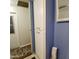 Bathroom with blue paneled walls and white cabinets at 303 S Recker Rd # 74, Mesa, AZ 85206