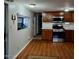 Spacious kitchen with light countertops, wood cabinets, and modern appliances at 303 S Recker Rd # 74, Mesa, AZ 85206