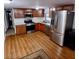 Kitchen features stainless steel appliances, light countertops, and wood flooring at 303 S Recker Rd # 74, Mesa, AZ 85206
