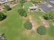 A beautiful aerial view showcasing the lush community lawn, bocce ball court, shuffleboard court and ramada at 3147 N Couples Dr, Goodyear, AZ 85395