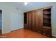 Bedroom featuring hardwood floors, custom shelving and large closet at 3147 N Couples Dr, Goodyear, AZ 85395