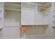 Spacious walk-in closet featuring custom shelving and ample storage space at 3147 N Couples Dr, Goodyear, AZ 85395
