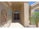 View of the front entrance with a security door and desert landscaping at 3147 N Couples Dr, Goodyear, AZ 85395