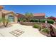 View of the front courtyard with desert landscaping and a tiled patio at 3147 N Couples Dr, Goodyear, AZ 85395