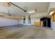 Spacious three car garage with custom cabinets for storage and built-in utility sink at 3147 N Couples Dr, Goodyear, AZ 85395