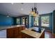 Large eat in kitchen with granite countertops, pendant lights and outdoor views at 3147 N Couples Dr, Goodyear, AZ 85395