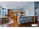 Large eat in kitchen with breakfast bar, dining table, and wood cabinets at 3147 N Couples Dr, Goodyear, AZ 85395