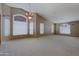 Spacious empty living room with vaulted ceilings and lots of natural light at 3147 N Couples Dr, Goodyear, AZ 85395