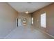 Spacious main bedroom boasts neutral walls, ceiling fan and carpeted floors at 3147 N Couples Dr, Goodyear, AZ 85395