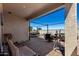 Comfortable covered back patio features brick pavers, seating, and an exercise machine at 3670 E Sandoval Dr, San Tan Valley, AZ 85140
