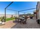 Entertain in this outdoor living space with pavers, chairs, and a fountain at 3670 E Sandoval Dr, San Tan Valley, AZ 85140