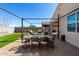 This backyard features pavers, desert landscaping, and an outdoor dining area at 3670 E Sandoval Dr, San Tan Valley, AZ 85140