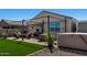 This backyard has an outdoor living area, synthetic grass, and a spa at 3670 E Sandoval Dr, San Tan Valley, AZ 85140