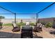 This backyard features outdoor seating, desert landscaping, and a cozy fire pit at 3670 E Sandoval Dr, San Tan Valley, AZ 85140