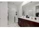 Modern bathroom featuring a glass-enclosed shower and a double sink vanity with sleek fixtures and ample counter space at 3670 E Sandoval Dr, San Tan Valley, AZ 85140