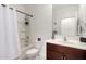 Bathroom featuring a shower-tub combo, modern sink, and fixtures, creating a functional and practical space at 3670 E Sandoval Dr, San Tan Valley, AZ 85140