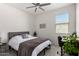 Bright bedroom featuring a comfortable bed and desk area, creating a functional and inviting living space at 3670 E Sandoval Dr, San Tan Valley, AZ 85140