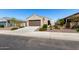 Single-story home with desert landscaping, neutral paint, and a driveway leading to a two-car garage at 3670 E Sandoval Dr, San Tan Valley, AZ 85140