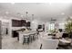 Bright, open living space with a kitchen island, dining area, and cozy living room with stylish furnishings at 3670 E Sandoval Dr, San Tan Valley, AZ 85140