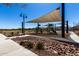 Community playground with slides, climbing structures, and shade canopy for a fun outdoor experience at 3670 E Sandoval Dr, San Tan Valley, AZ 85140