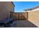Wooden gate on side of the house, offering easy access to the backyard area at 3907 S 75Th Dr, Phoenix, AZ 85043
